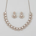 Aria Crystal Necklace Set silver polki collar necklace with matching chandelier drop earrings on gray background