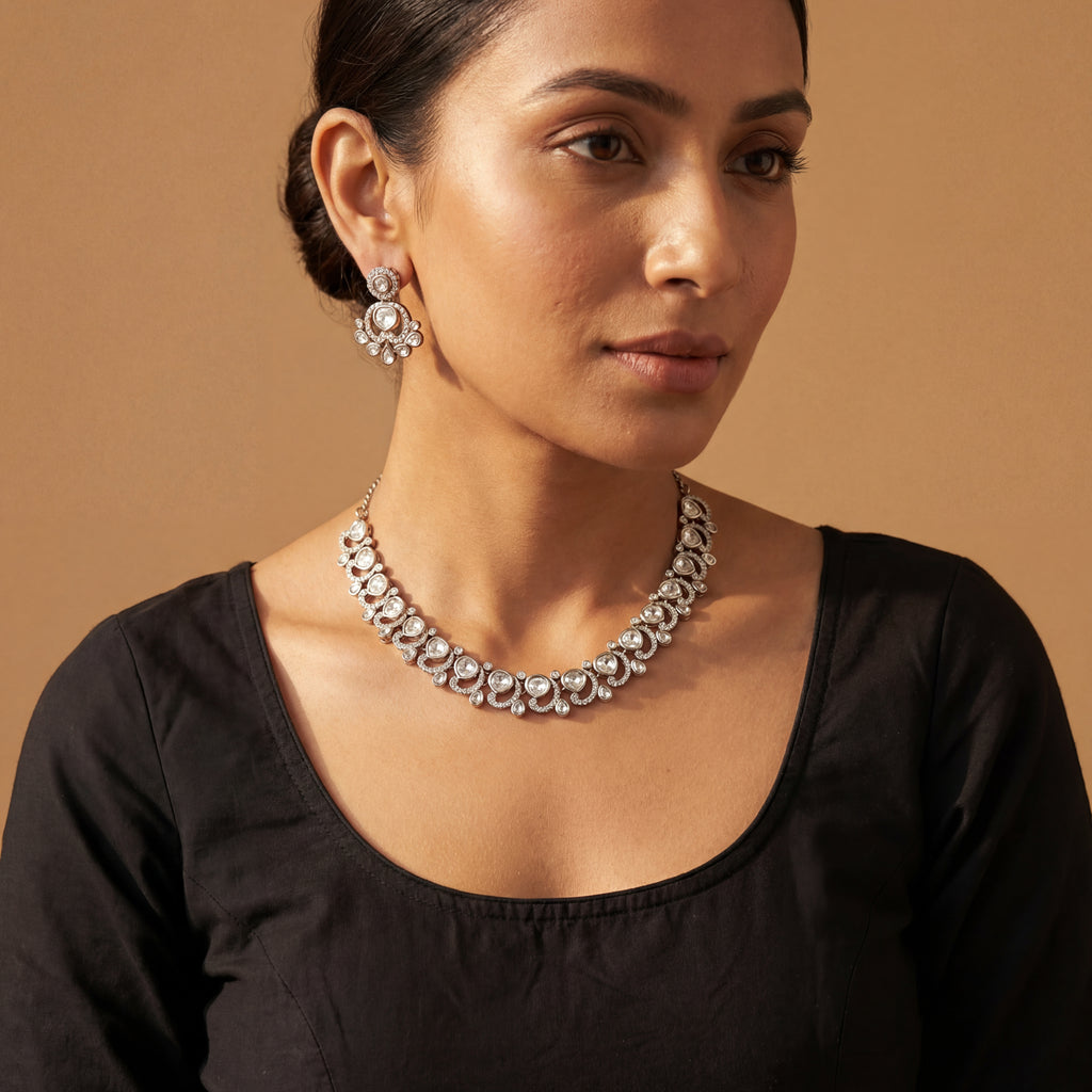 Aria Crystal Necklace Set detail showing clear flat-cut polki stones, crescent halos, and pear-shaped drops