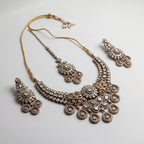 Aria Silver Necklace Set detail showing central floral polki motif and pear-shaped dangling stone charms
