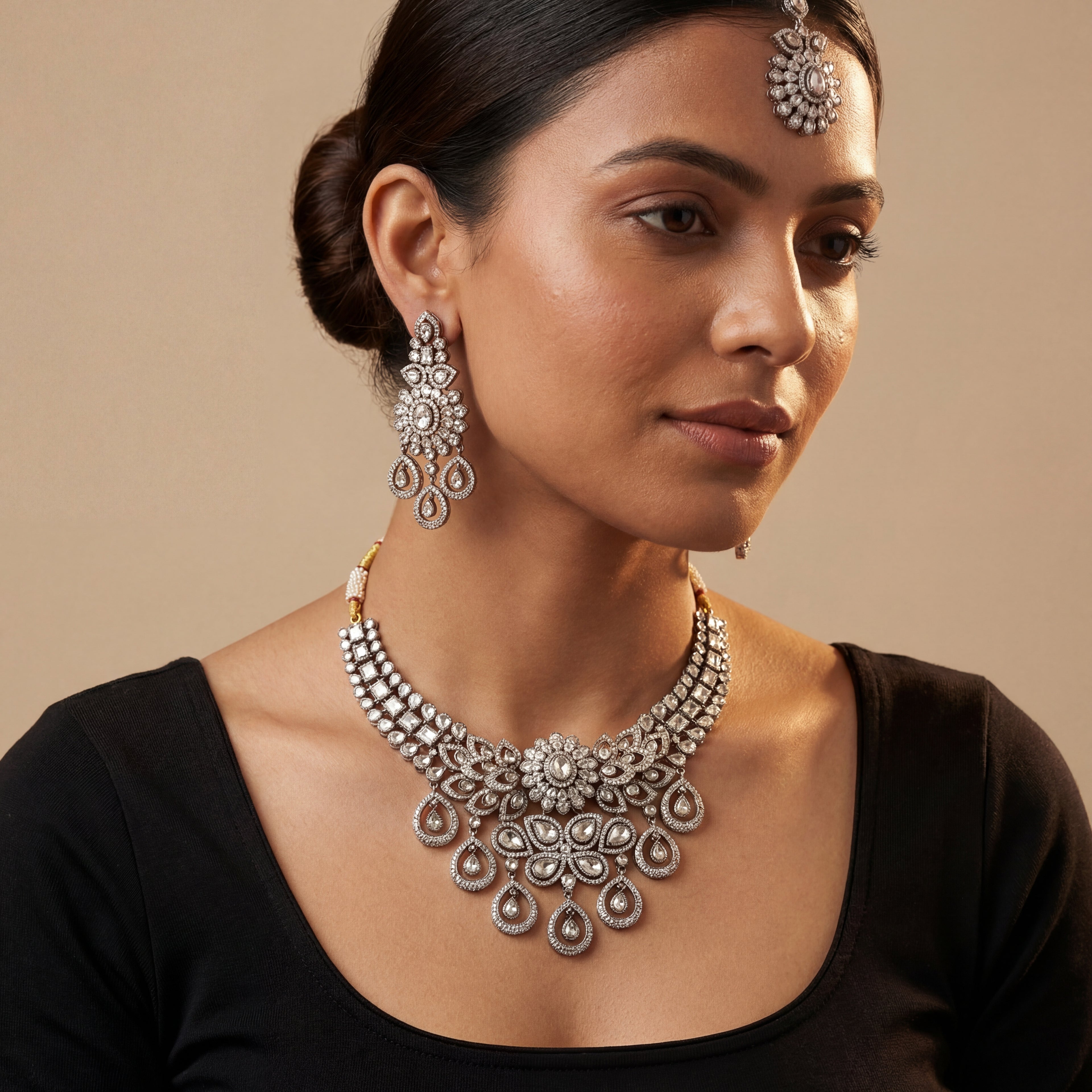 Aria Silver Necklace Set detail showing central floral polki motif and pear-shaped dangling stone charms