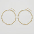 Gilded Leaf Crystal Anklets pair of gold-tone pavé leaf payals on gray background