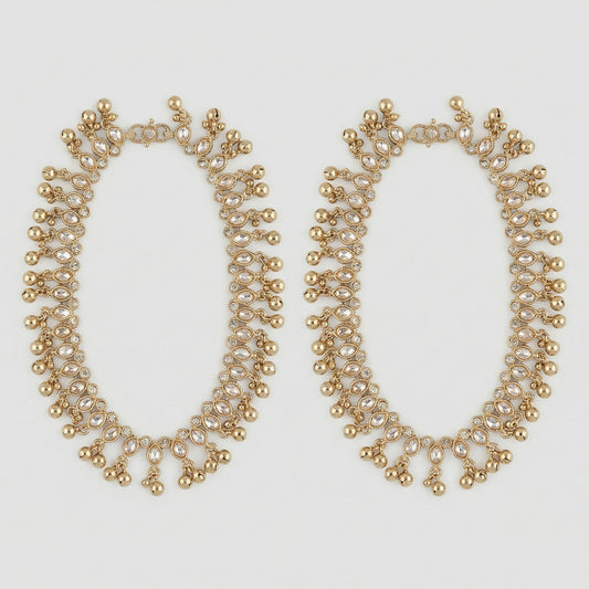 Sitara Kundan Payal pair of gold-tone crystal payals with ghungroo fringe on gray background