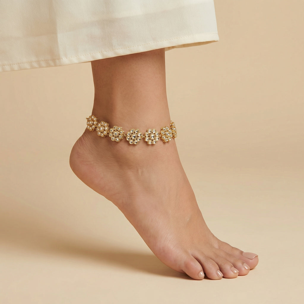Gilded Blossom Anklets detail showing six-petal flower links and pavé centers