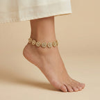 Gilded Blossom Anklets detail showing six-petal flower links and pavé centers