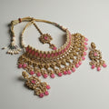 Studio flatlay of the silver-tone pink choker with matching earrings