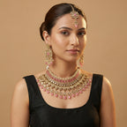 South Asian woman wearing the silver-tone pink choker with matching earrings — bridal look