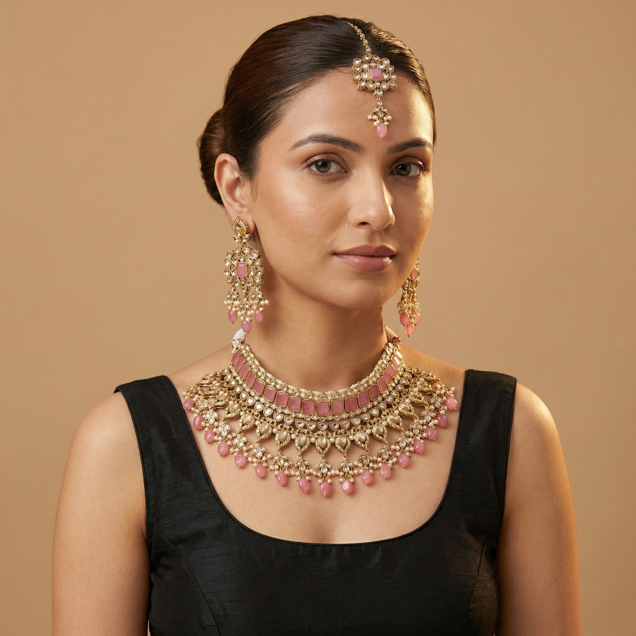 South Asian woman wearing the silver-tone pink choker with matching earrings — bridal look