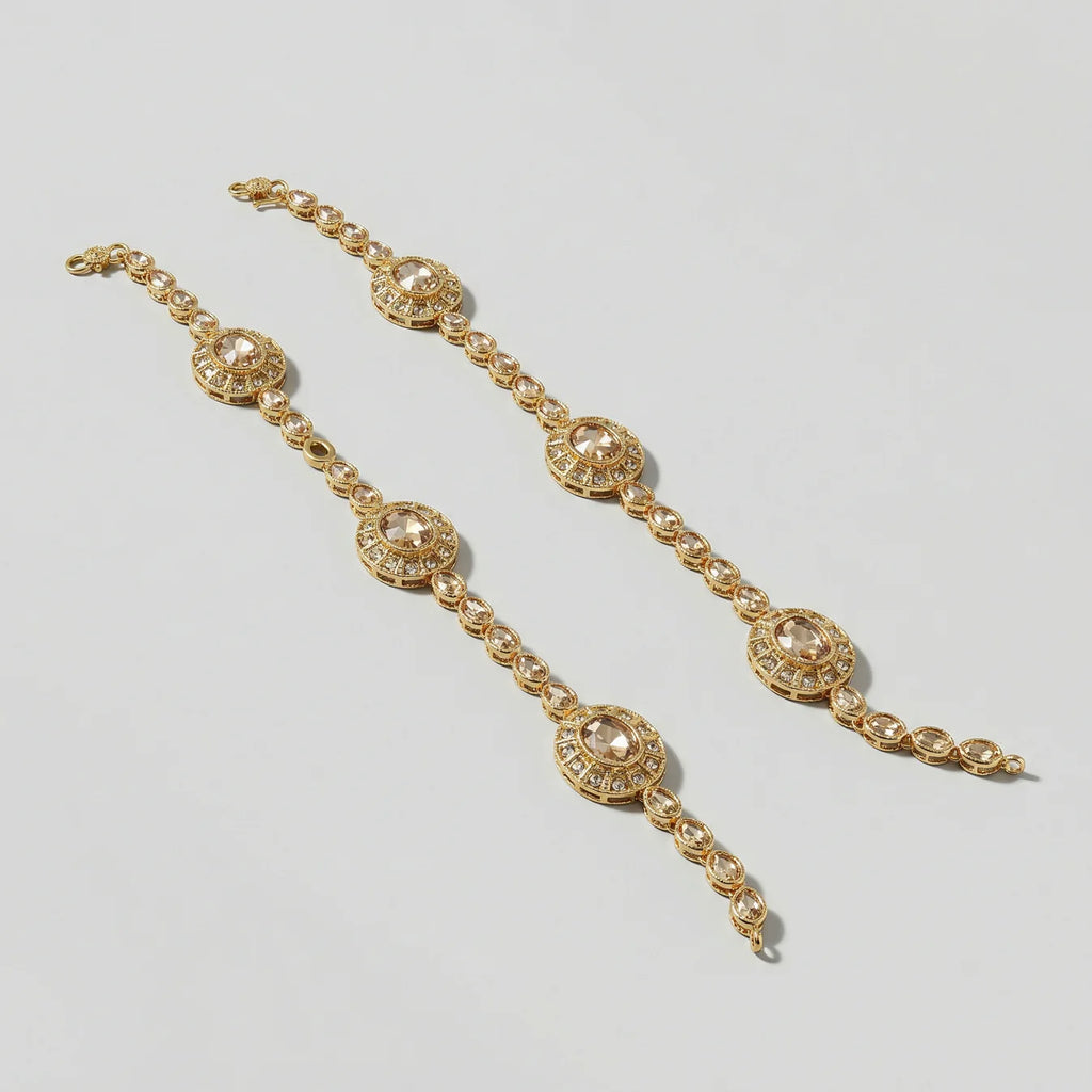 Gilded Kundan Anklets detail showing champagne center stones and clear pavé halos