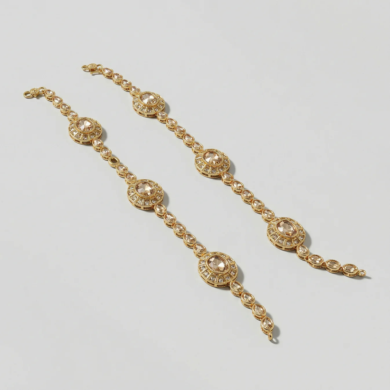 Gilded Kundan Anklets detail showing champagne center stones and clear pavé halos