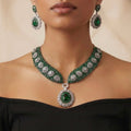 Emerald Crest Statement Necklace Set gold-plated statement necklace set with matching earrings in a studio flatlay