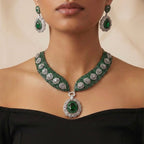 Emerald Crest Statement Necklace Set gold-plated statement necklace set with matching earrings in a studio flatlay