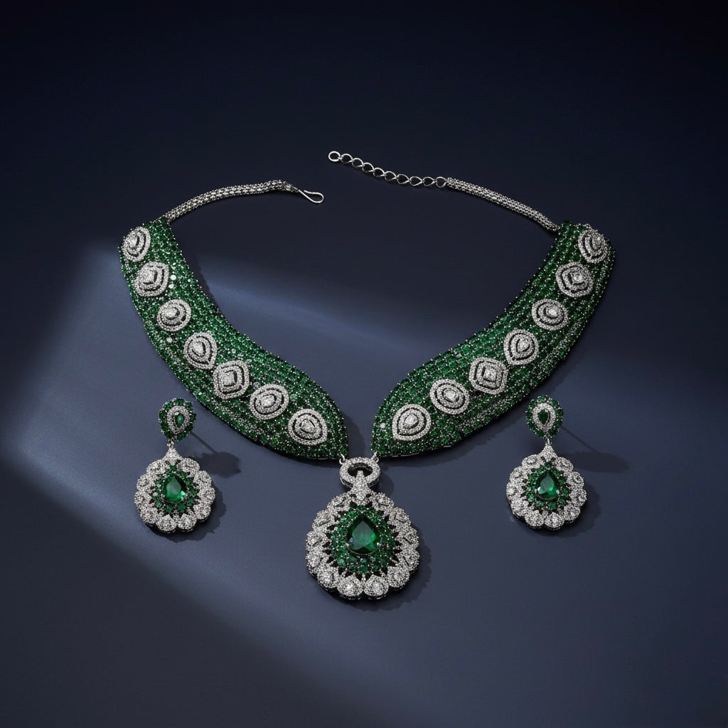 Close-up flatlay of Emerald Crest Statement Necklace Set necklace and matching earrings