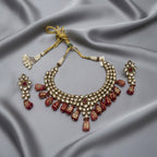 Detail flatlay of the scarlet statement necklace, highlighting the stonework and finish.