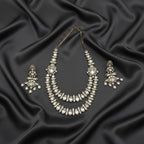 Detail flatlay of the silver-tone crystal statement necklace with layered crystal strands