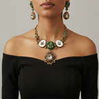 Studio flatlay of the gold-tone mother-of-pearl necklace with matching earrings