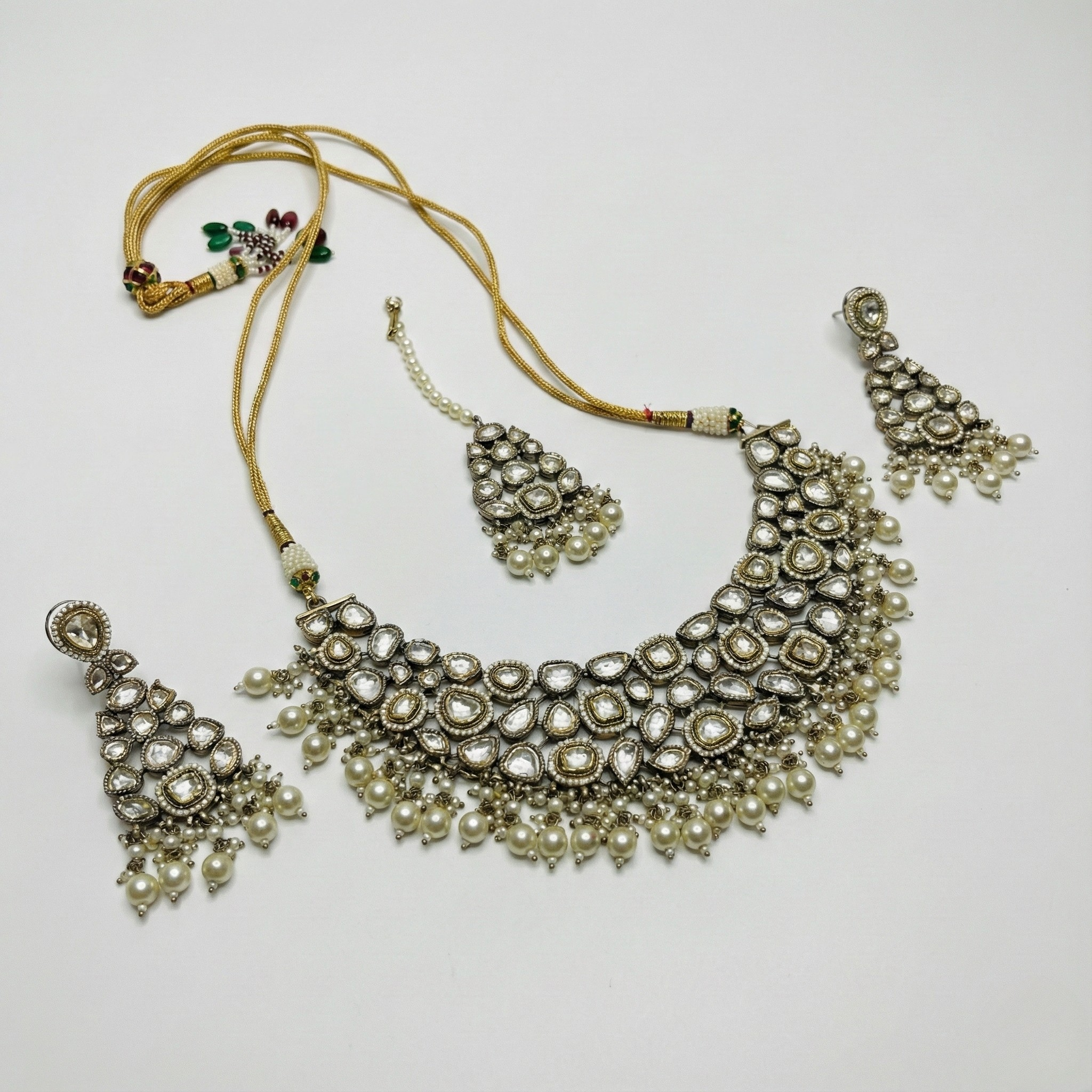 South Asian woman wearing the white stone necklace set — bridal look.