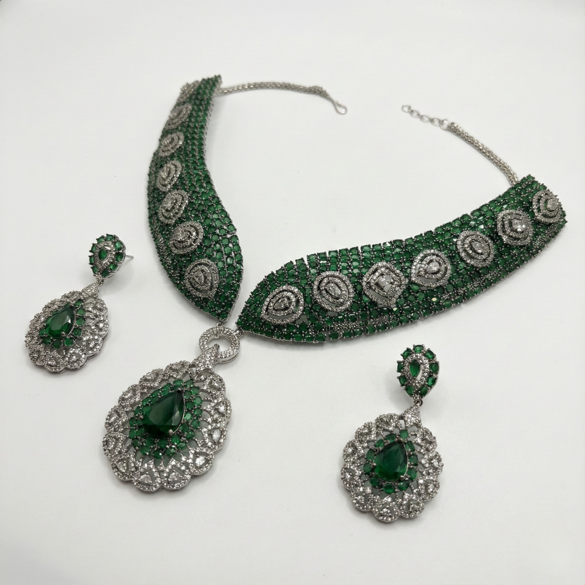 South Asian woman wearing Emerald Crest Statement Necklace Set statement necklace with matching earrings — bridal look