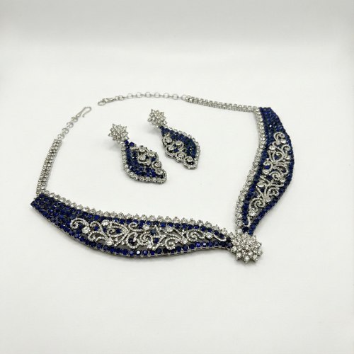 South Asian woman wearing Blue Noir Statement Necklace Set statement necklace with matching earrings — bridal look