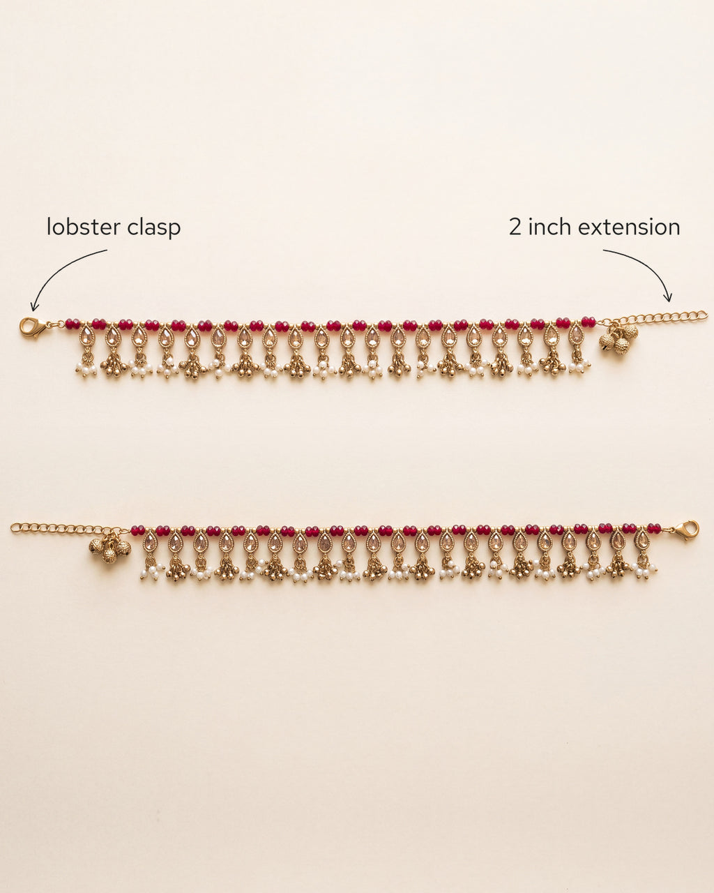 Bloom Drop red anklet pair laid flat, showing the lobster clasp and 2 inch extension chain