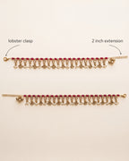 Bloom Drop red anklet pair laid flat, showing the lobster clasp and 2 inch extension chain