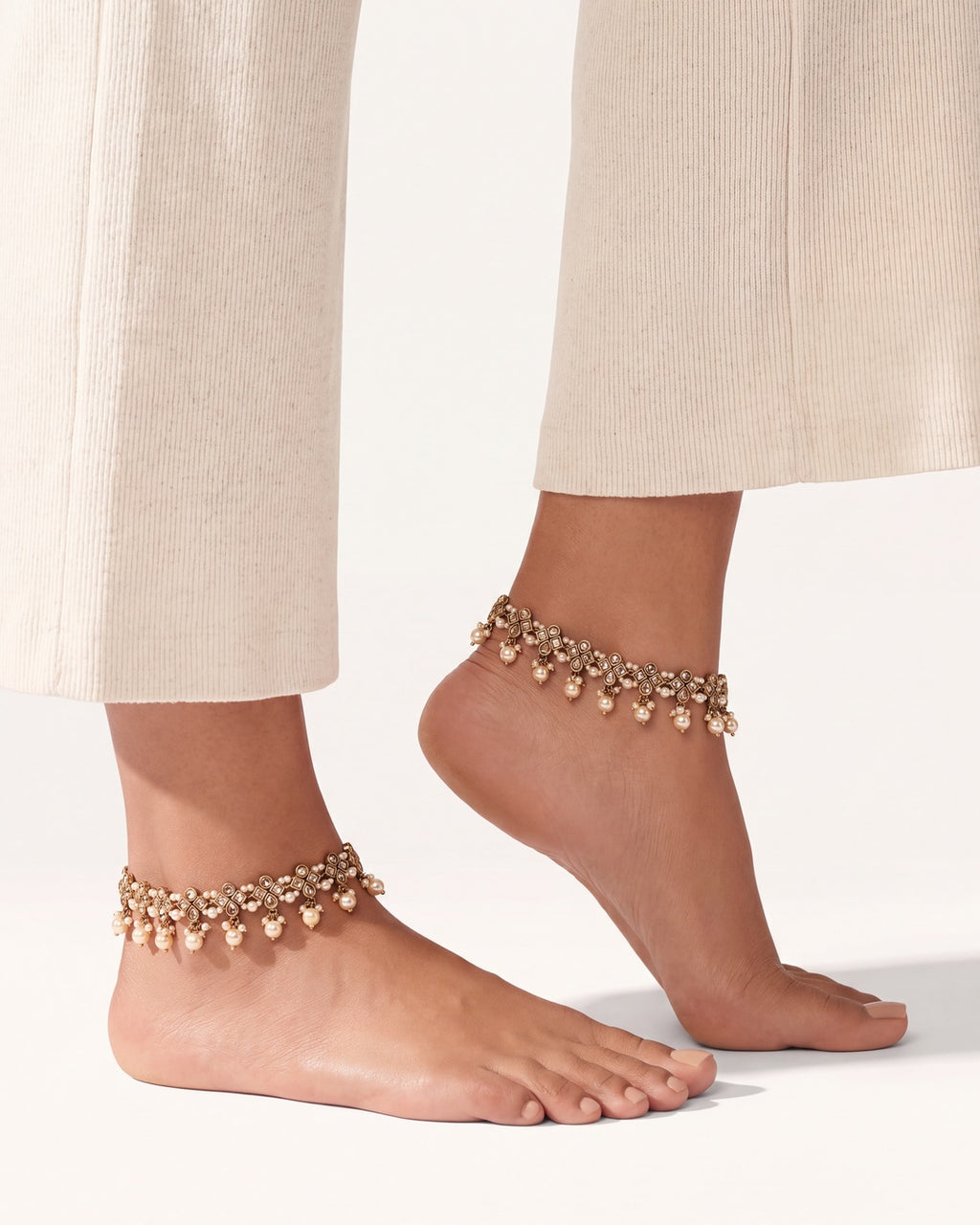 Matching pair of Classic Pearl anklets worn on both ankles