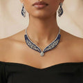 Blue Noir Statement Necklace Set silver-plated statement necklace set with matching earrings in a studio flatlay