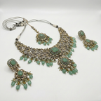South Asian woman wearing Soft Sage Drop Necklace Set with sage-toned necklace and earrings — bridal look