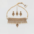 Zara Polki Necklace Set gold-tone polki choker with earrings and tikka on gray background
