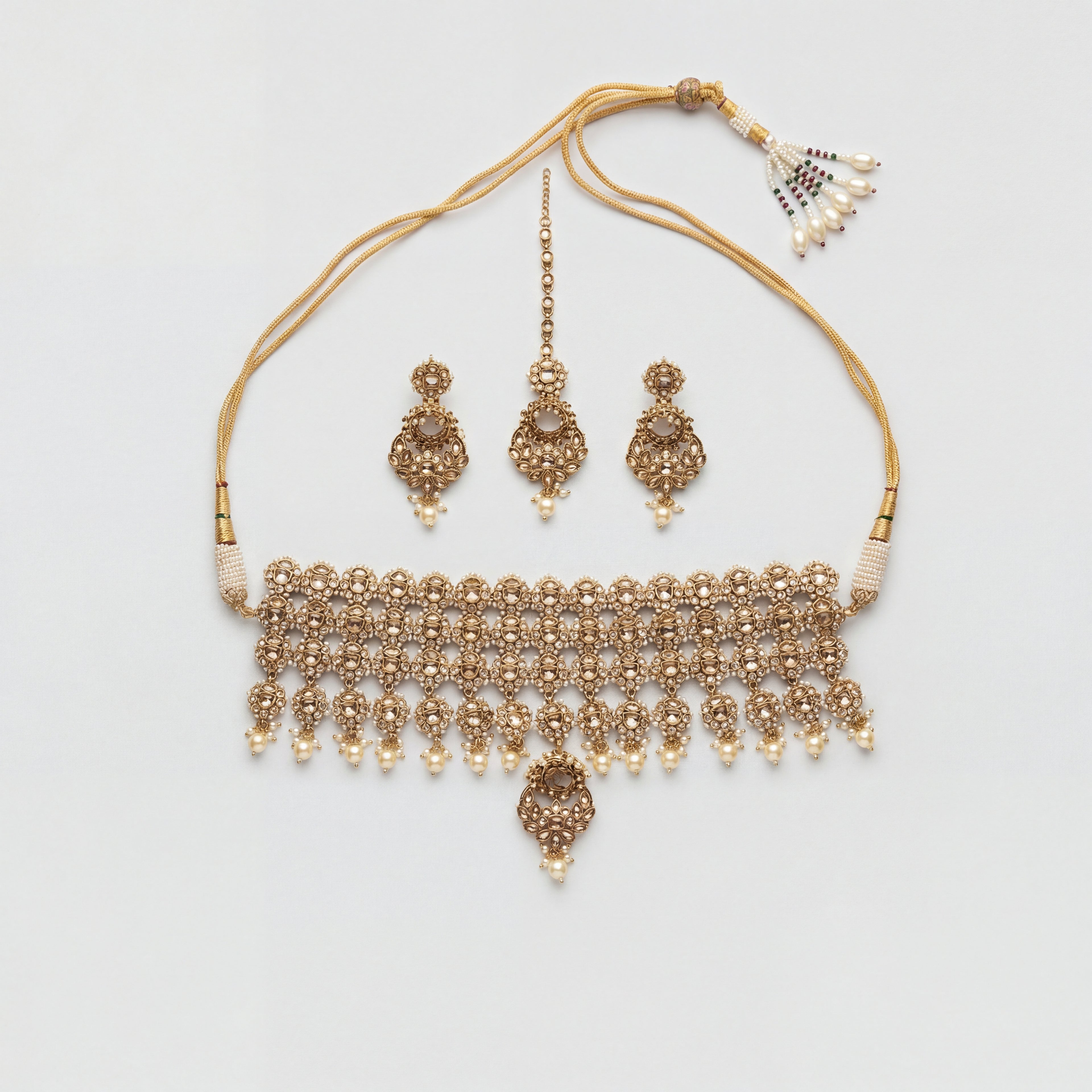 Zara Polki Necklace Set gold-tone polki choker with earrings and tikka on gray background