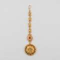 Kamal Floral Tikka antique gold maang tikka with lotus chain and floral round pendant on gray background