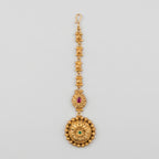 Kamal Floral Tikka antique gold maang tikka with lotus chain and floral round pendant on gray background
