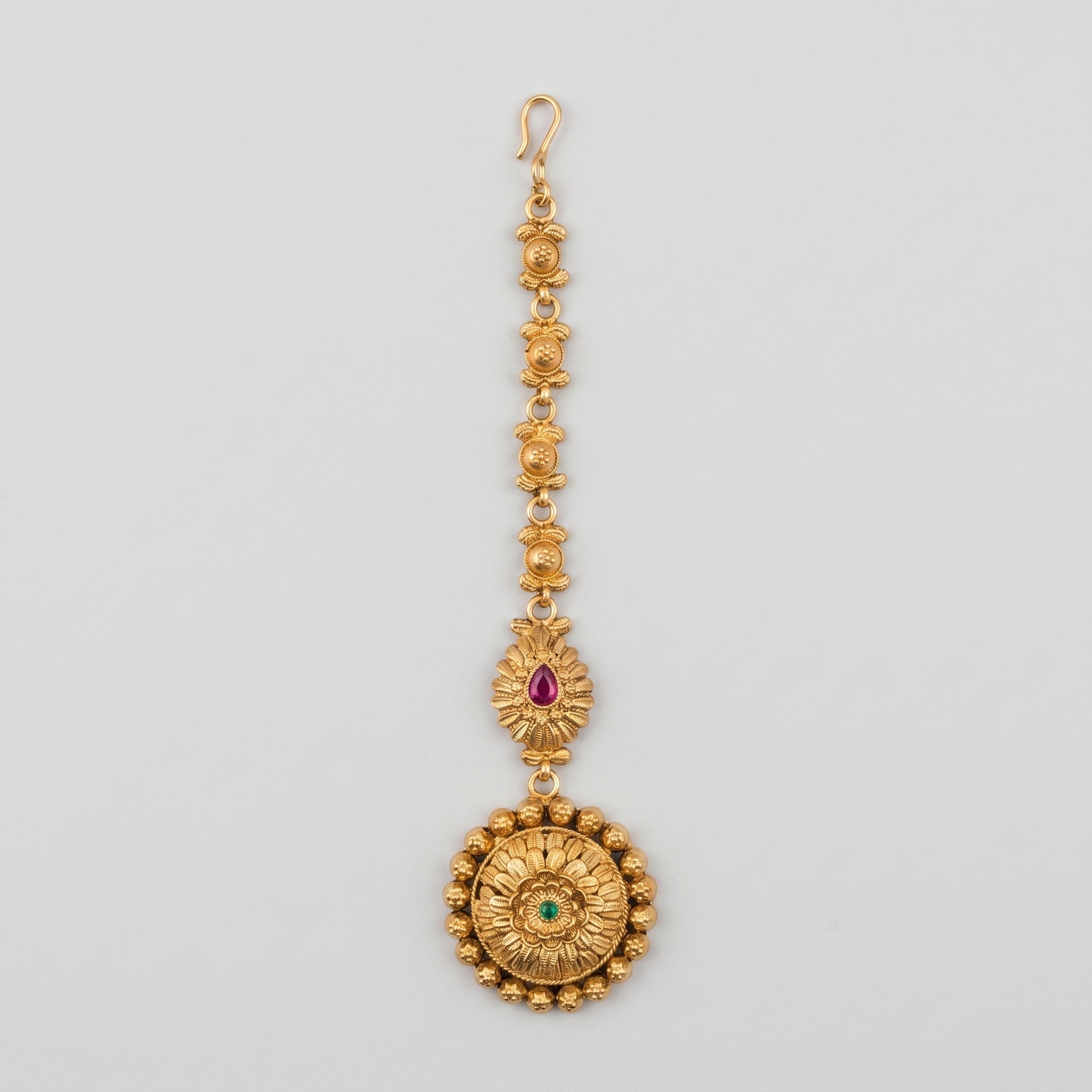 Kamal Floral Tikka antique gold maang tikka with lotus chain and floral round pendant on gray background