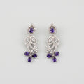 Pari Amethyst Earrings silver floral drops with purple pear stones and clear crystal pavé on gray background