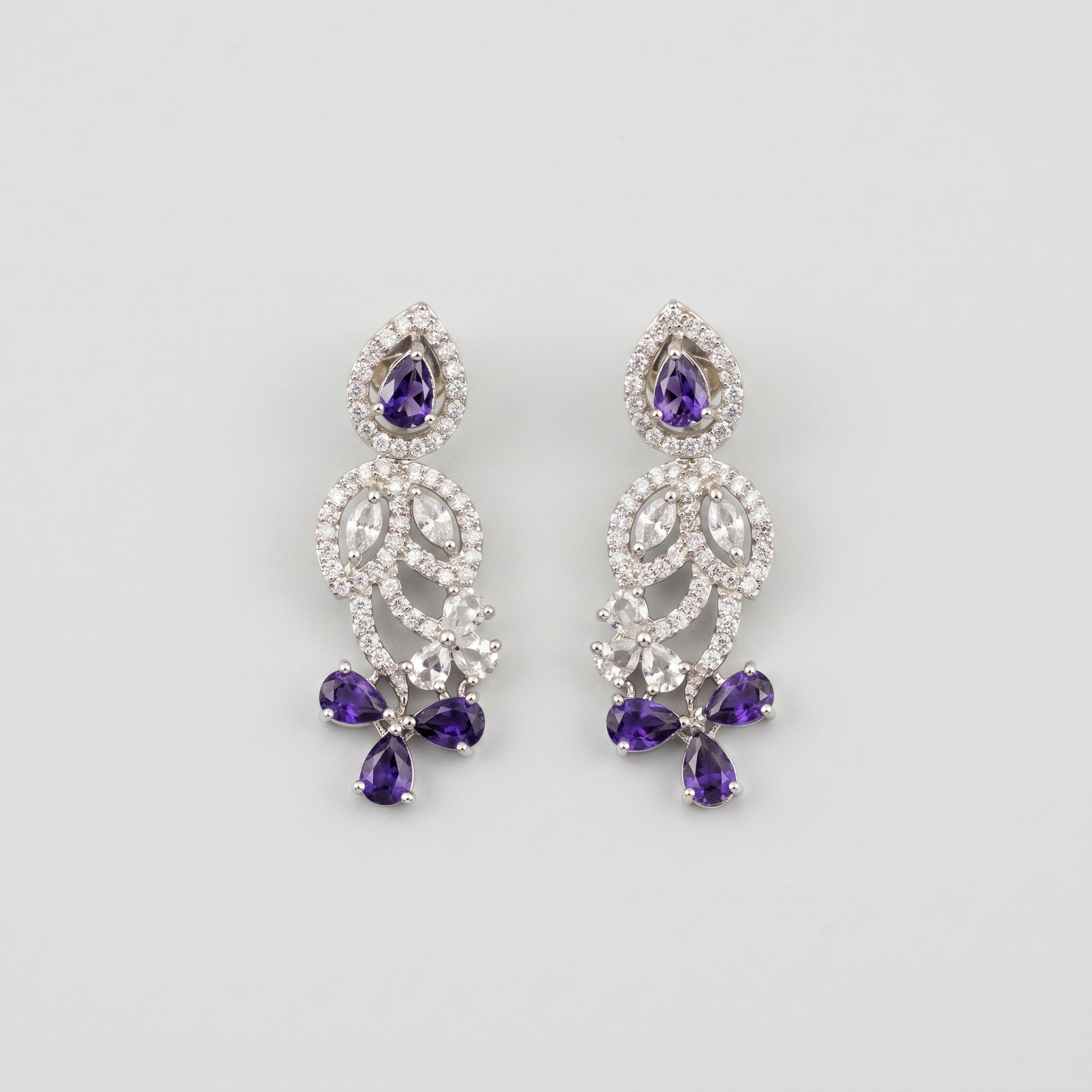 Pari Amethyst Earrings silver floral drops with purple pear stones and clear crystal pavé on gray background