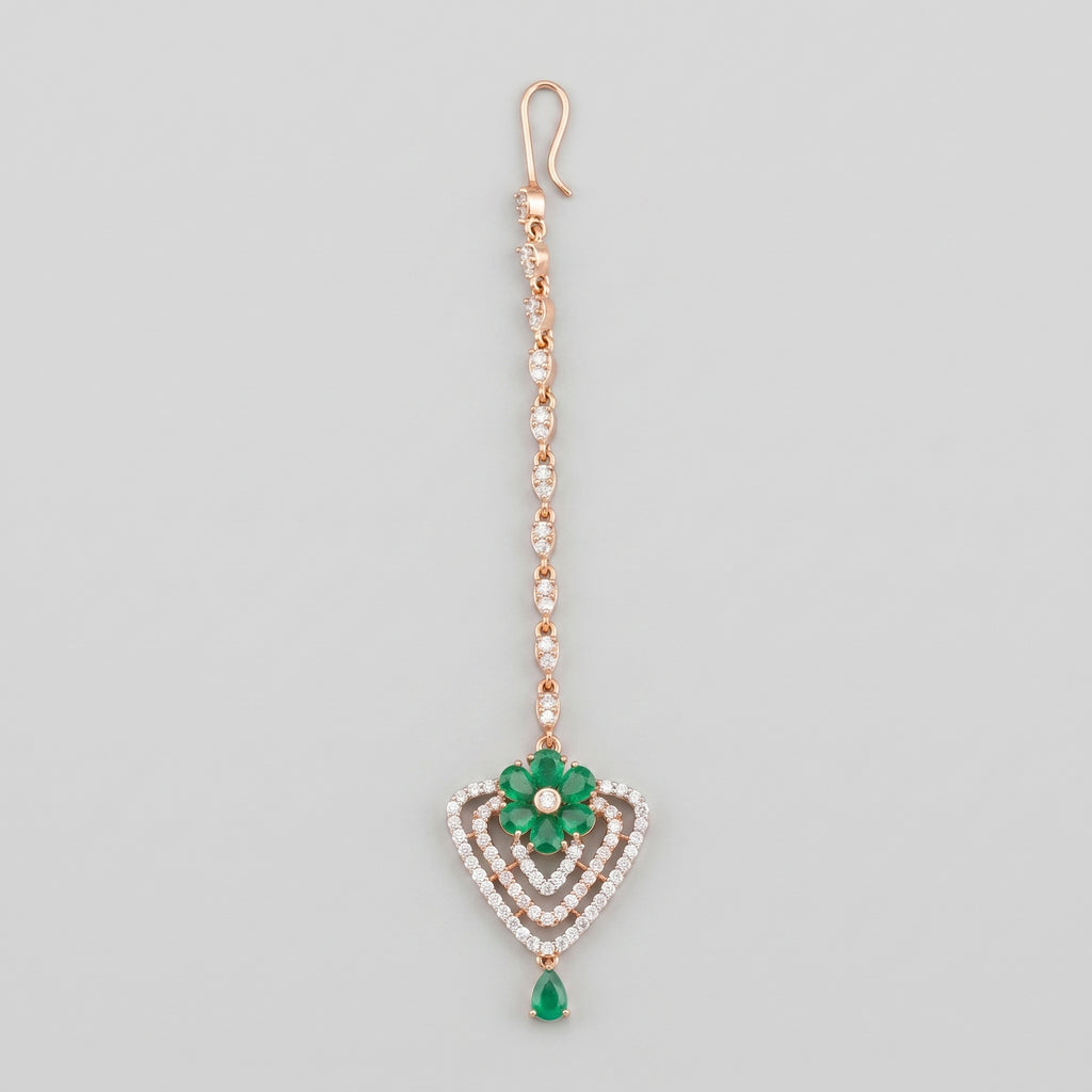 Pushpa Emerald Tikka rose gold-tone maang tikka with green floral heart pendant on gray background