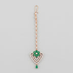 Pushpa Emerald Tikka rose gold-tone maang tikka with green floral heart pendant on gray background