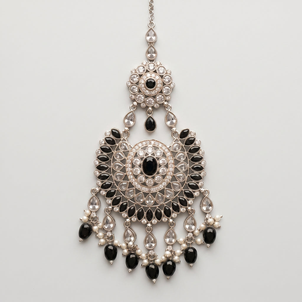 Onyx Pearl Tikka silver chaandbali maang tikka with black stones and pearl fringe on gray background
