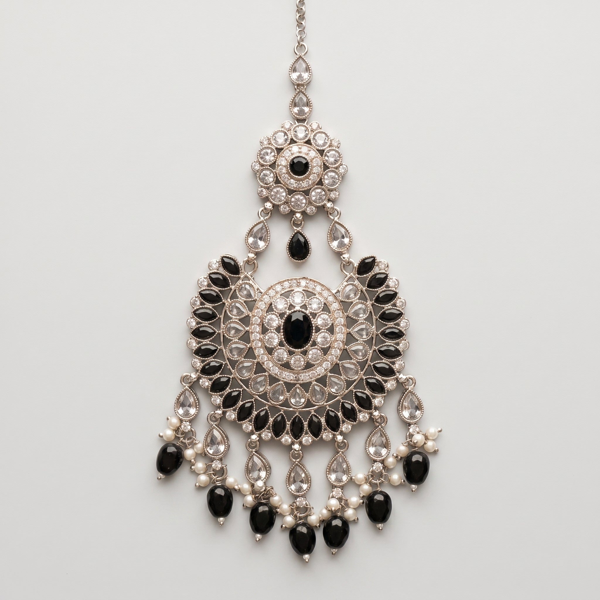 Onyx Pearl Tikka silver chaandbali maang tikka with black stones and pearl fringe on gray background
