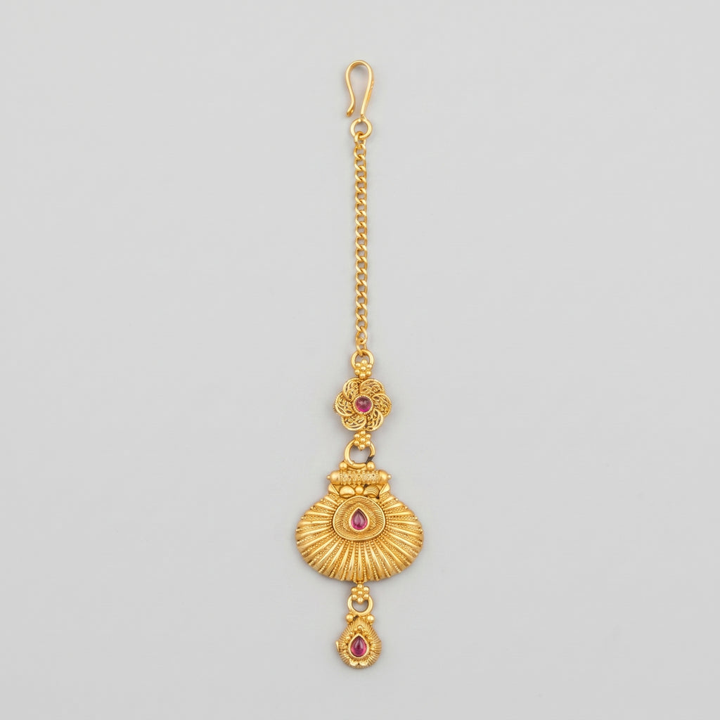Priya Ruby Tikka matte gold maang tikka with ruby-pink stones on gray background