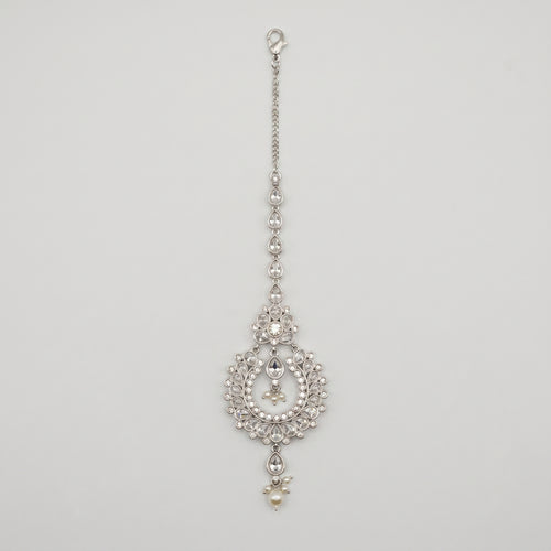 Rani Pearl Tikka silver-tone maang tikka with pearl drops and open circle pendant on gray background