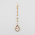 Aira Moonstone Tikka gold maang tikka with pear crystal chain and moonstone teardrop pendant on gray background