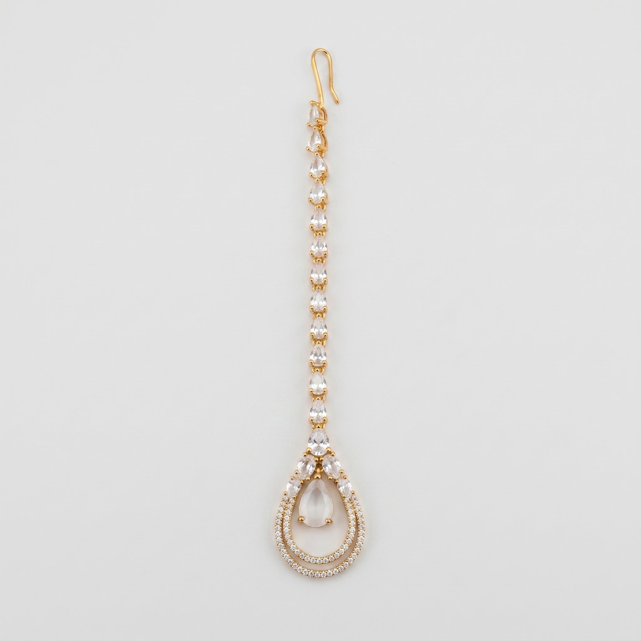 Aira Moonstone Tikka gold maang tikka with pear crystal chain and moonstone teardrop pendant on gray background