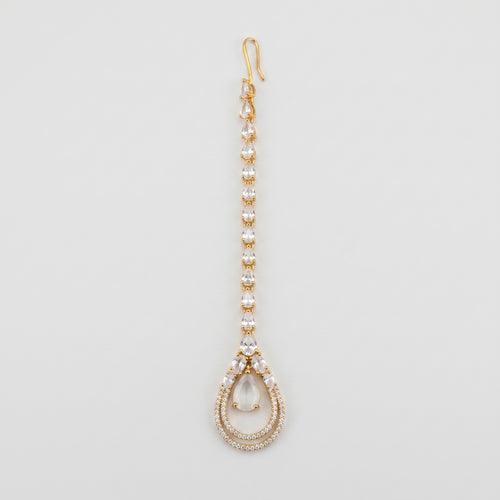 Aira Moonstone Tikka gold maang tikka with pear crystal chain and moonstone teardrop pendant on gray background