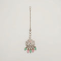 Mridul Tikka silver maang tikka with pink center and mint green pink teardrop beads on gray background