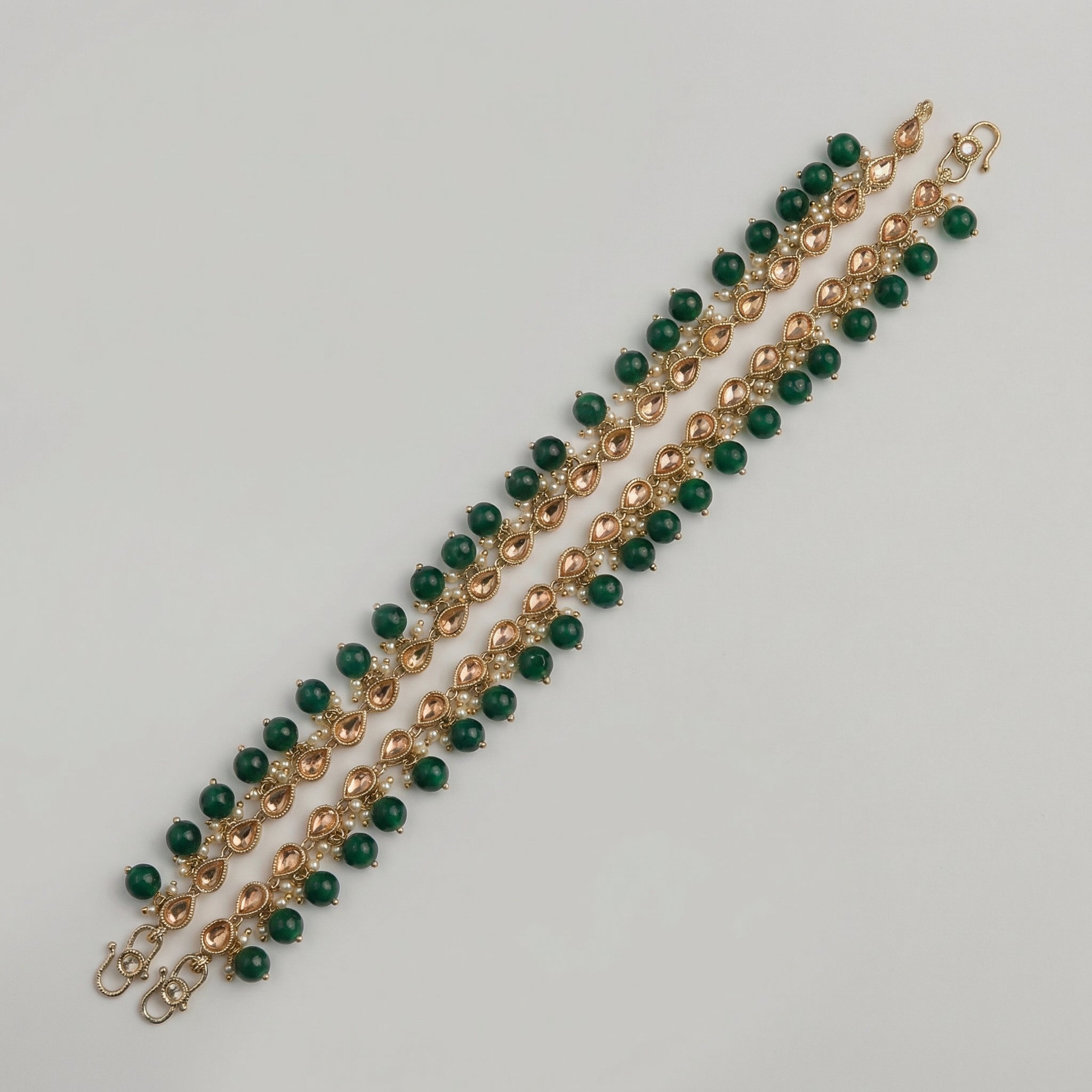 Rani Polki Anklet pair of gold-tone kundan payals with green beads and pearls