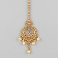 Jadau Pearl Tikka gold chandbali maang tikka with champagne stones and cream pearl drops on gray background