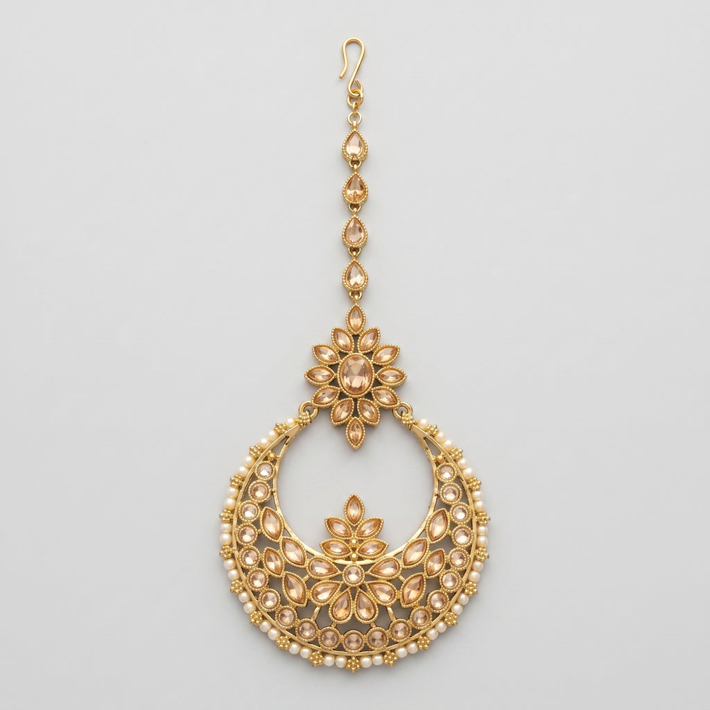 Kamal Crystal Tikka gold chaandbali maang tikka with champagne crystals and pearl fringe on gray background