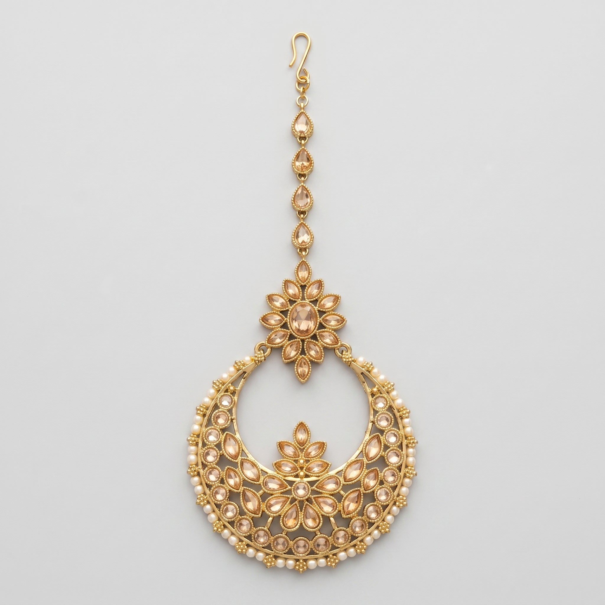 Kamal Crystal Tikka gold chaandbali maang tikka with champagne crystals and pearl fringe on gray background