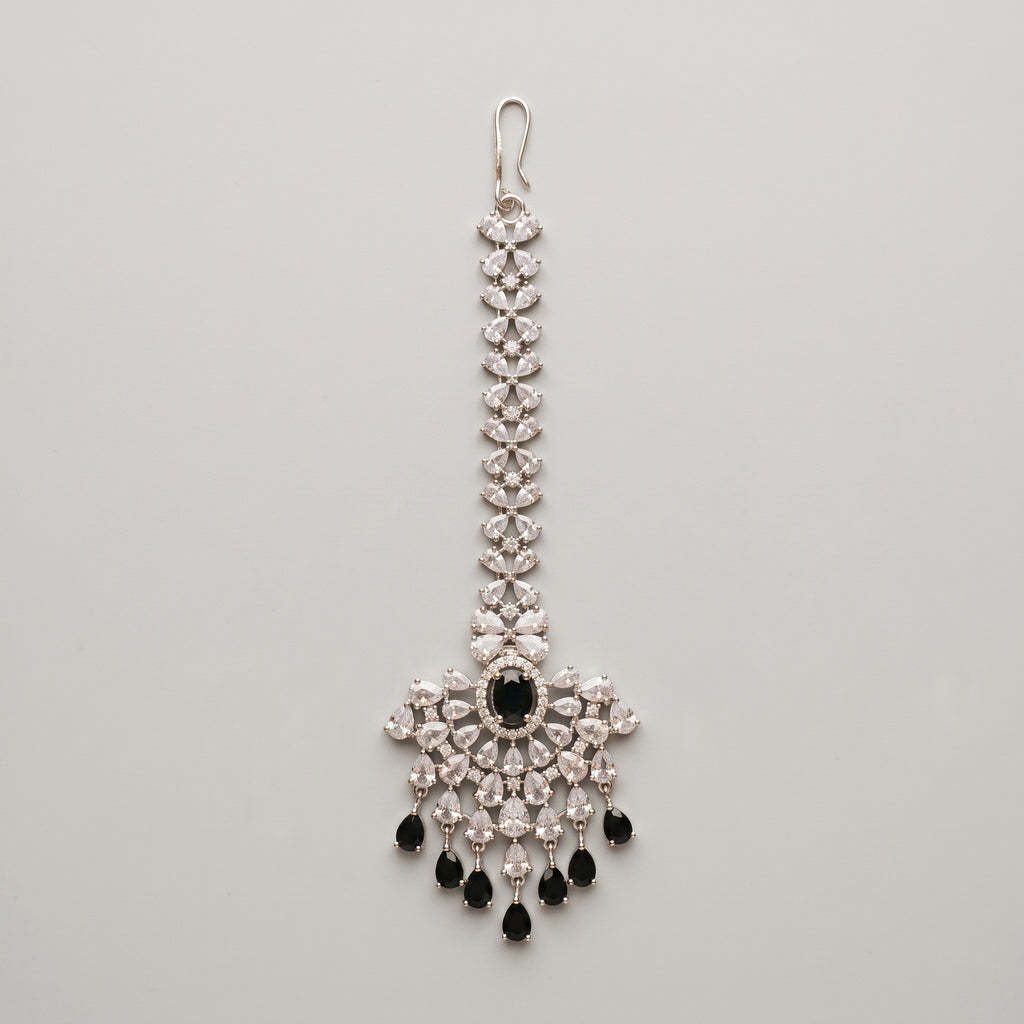 Zoya Onyx Tikka silver maang tikka with black and clear stones on gray background
