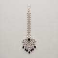 Zoya Onyx Tikka silver maang tikka with black and clear stones on gray background